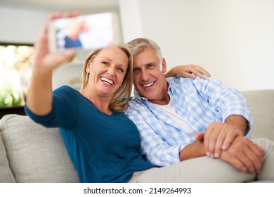 Capturing The Beauty Of Love. Cropped Shot Of A Mature Couple Taking A Selfie Together At Home.