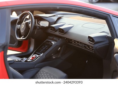 Capturing the epitome of automotive luxury and performance, this image showcases the sleek and stylish Lamborghini steering wheel