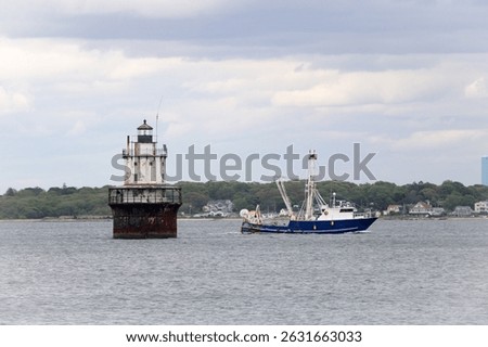 Capturing the iconic Sparkplug Lighthouse and the rugged charm of fishing boats. Images feature coastal and harbor scenes, showcasing marine architecture, ocean waves, and working waterfronts