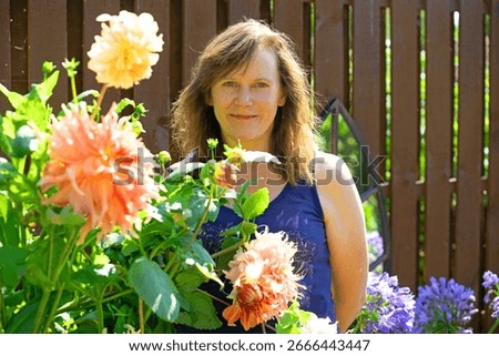 Capturing the joy provided by a summer garden, that takes advantage of the enormous potential of dinner plate dahlias to provide a spectacular and colourful display.