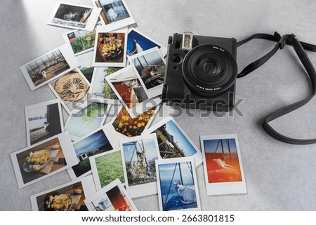 Capturing memories through an analog camera surrounded by colorful snapshots of life