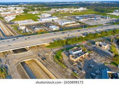 Capturing multi lane highway intersection surrounding commercial complex in Houston, Harris County, Texas complex road systems, parking areas
