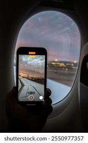 Capturing a sunset view from an airplane window with a smartphone