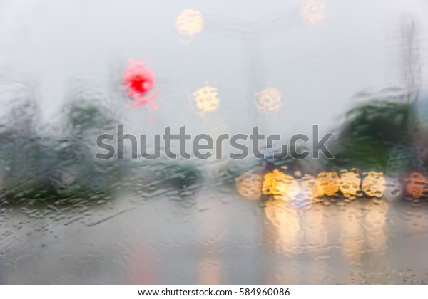In the car,\
Abstract image of raining\
day.