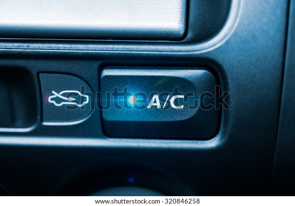 Car AC air conditioner button light on white blue\
color tone cooling concept