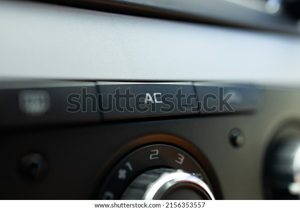 Car ac air turn on off button close up.\
auto air conditioning repair service\
concept.