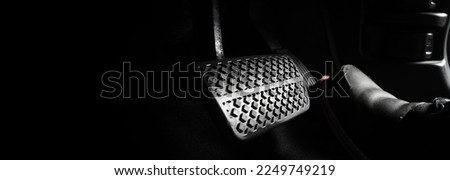 Car accelerate and brake foot pedal. Close up foot press or push foot break and accelerate pedal of a car to drive ahead. Driver driving the car by pressing or pushing accelerator pedals of the car.