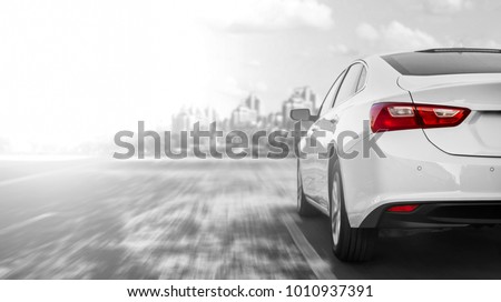A car accelerating on a highway when traveling to the city