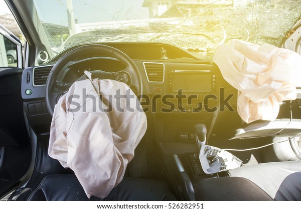 Car of accident Make airbag explosion damaged at\
claim the insurance company. Working car repair  inspection at\
damaged of accident. Claim the insurance company.  image blur focus\
 style.