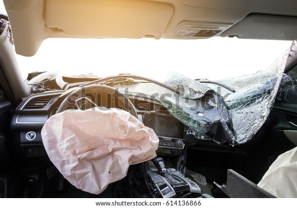 Car of accident make airbag explosion\
damaged at claim the insurance company. Double exposure car\
accident and road on cityscape. Image blur focus\
style.