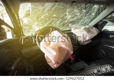 Car of accident make front windshield cracked and airbag explosion damaged at claim the insurance company. Working car repair  inspection at damaged of accident. image blur focus  style.
