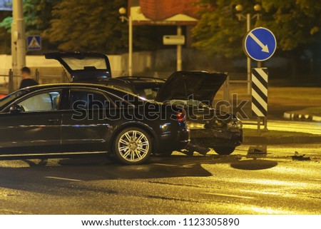 car accident in the night city. two vehicles crashed in a metropolitan street