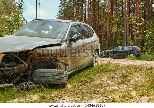 Car accident on rural\
road in June car after a collision with other vechicle,\
transportation background