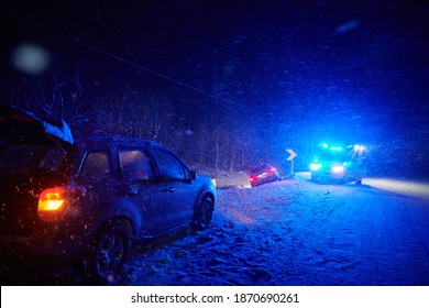 car accident on slippery winter road at night