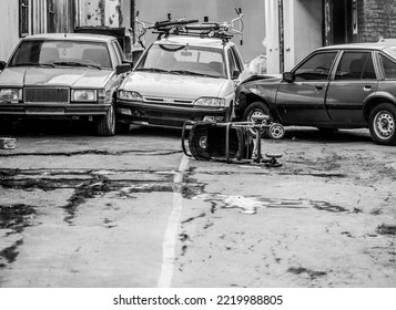 A Car Accident On The Street. An Overturned Baby Stroller Against The Background Of Colliding Cars