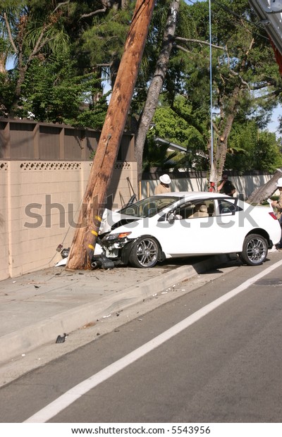 a car accident where the car sheers a 95 foot\
utility pole off at ground level and moves it 20 feet forward\
snapping it in two parts
