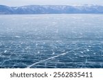 The car is across the frozen lake , Baikal ,Russia