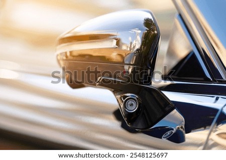 Car advanced side view camera system integrated into rearview mirror, enhanced blind spot detection and rear visibility. Side area monitoring of the vehicle. Car side mirror with blind spot monitoring