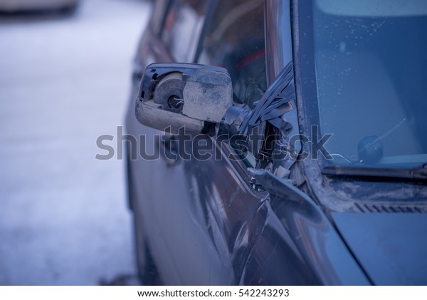 The car after\
the accident - a broken\
mirror