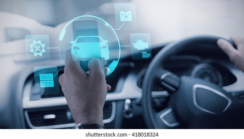 Car against businessman using a smartphone - Shutterstock ID 418018324