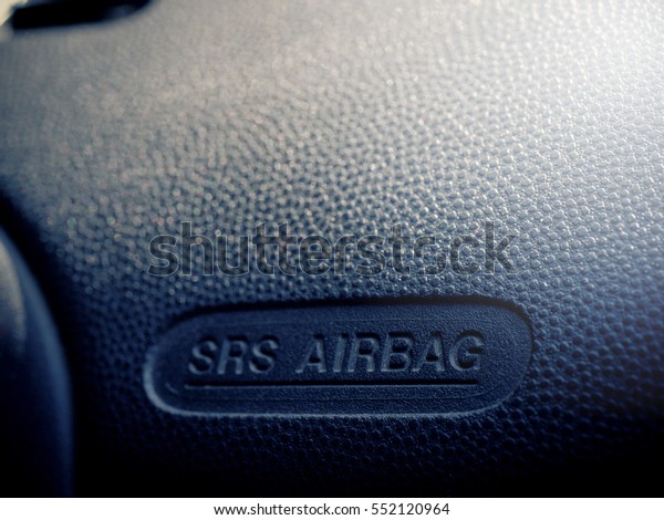 Car Air bag logo on\
the front seat panel