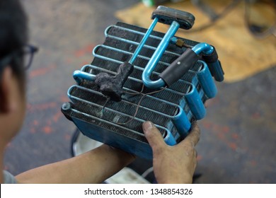 Car air conditioner evaporator coil close up.Auto mechanic worker fixing air condition system in car garage.
Maintenance service, Repair checking vehicle engine tool.