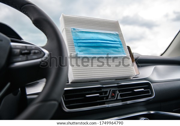 car air conditioner air filter and a protective\
mask against bacteria on it