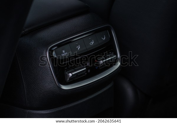 Car air conditioning buttons close up view\
inside a car. Car temperature conditioner dashboard panel. Adjust\
air conditioner.