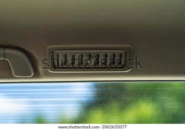 Car air\
conditioning close up view. The air conditioner flow inside the\
car. Detail interior of car. Air\
ducts.