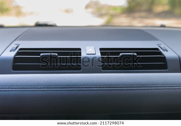 Car air conditioning. The air\
flow inside the car. Emergency button. Detail interior of\
car.