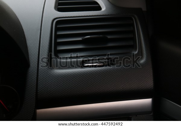 Car air\
conditioning system grid panel on\
console