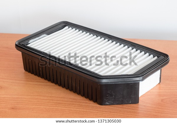 Car air filter. Spare part for car engine air\
filter for cleaning dust and\
dirt.