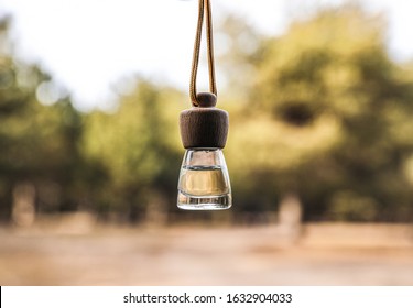 Car Air Freshener Hanging On Blurred View, Closeup