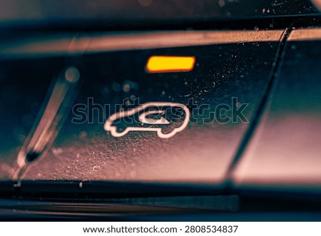 Car Air Recirculation Control Button Close Up, Dashboard HVAC Switch with Amber LED Light in Vehicle Interior