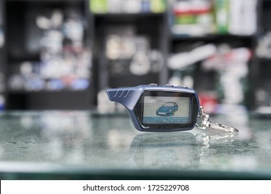 Car Alarm Keychain  On The Glass With Small Depth Of Field