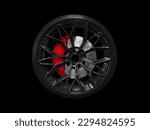 Car alloy wheel and tyre isolated on black background. New alloy wheel with tire and yellow carbon ceramic brakes. Alloy rim isolated. Car wheel disc. Car spare parts.