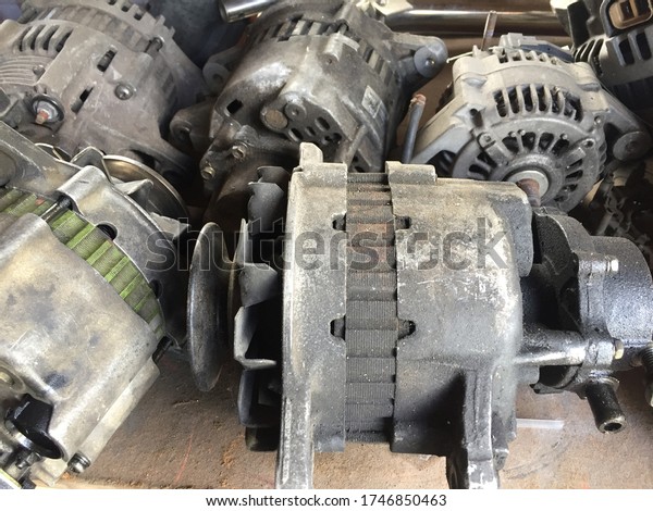 Car alternators scrap in\
car mechanic workshop. Alternator is one of the main part in the\
car engine.