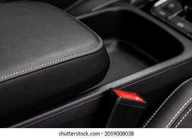 Car armrest opened. Opened armrest in the car for driver. - Shutterstock ID 2059008038