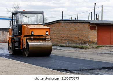 Car For Asphalt Laying. Road Construction Works With Roller Compactor Machine And Asphalt Finisher.