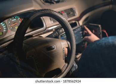 Car Audio Engineer Is Adjusting A Car Stereo System Close Up.