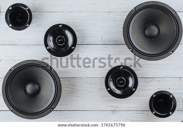 Car audio, car speakers on a white wooden\
background. Copy space