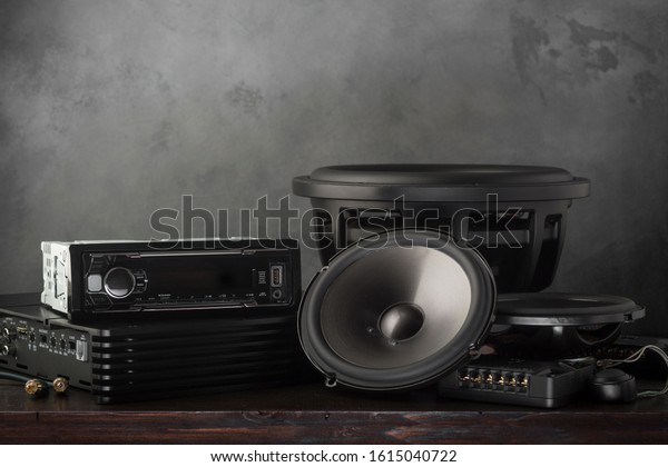 car audio, car speakers, subwoofer and\
accessories for tuning. Dark background.\
