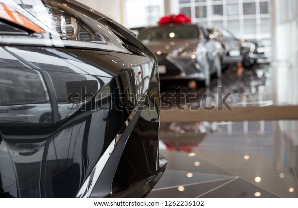 Car auto dealership. New cars at dealer\
showroom. Prestigious\
vehicles.