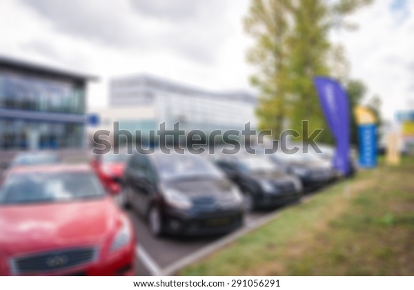 Car auto dealership themed blur background with
bokeh effect