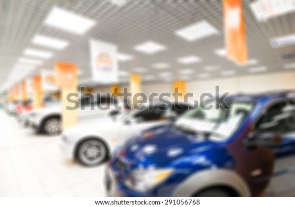 Car auto dealership themed blur background with\
bokeh effect