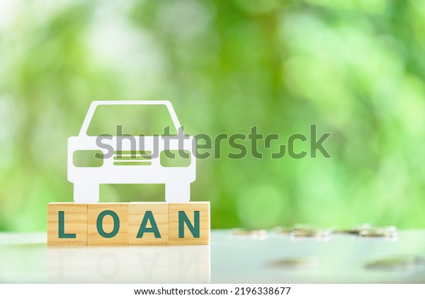 Car or auto loan, financial concept : Sedan car\
on wood blocks with the word LOAN. An auto loan is a secured loan,\
which means that the value of the vehicle serves as security for\
the bank or lender.