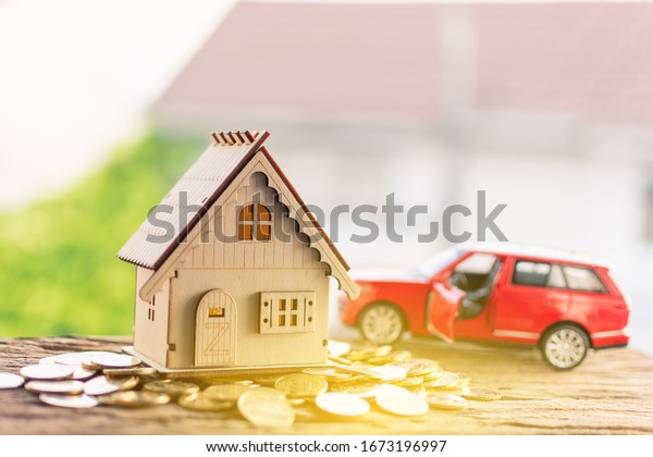 Car background on coins Car\
loans, finance, saving money, insurance and ideas about buying\
cars