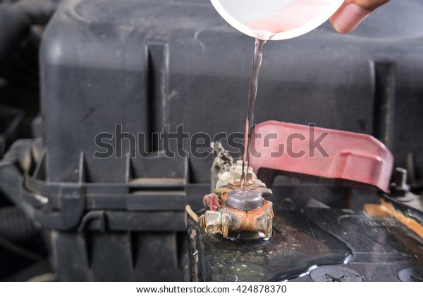 Car battery corrosion on
terminal,Dirty battery terminals,Cleaning battery terminals by hot
water.