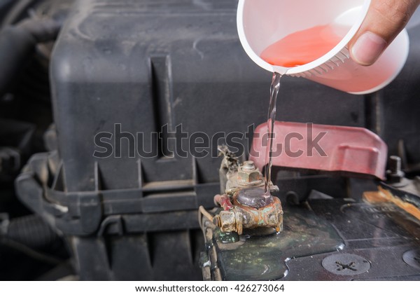 Car battery corrosion on
terminal,Dirty battery terminals,Cleaning battery terminals by hot
water.