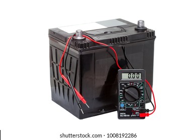 Car Battery With Digital Multimeter Isolated On White Background.